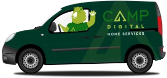 A green van with "Camp Digital Home Services" branding on the side. A bear mascot is in the driver’s seat, waving.