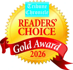 A gold seal with “Tribune Chronicle Readers’ Choice Gold Award 2026” in red and blue text, featuring a red ribbon across the bottom.